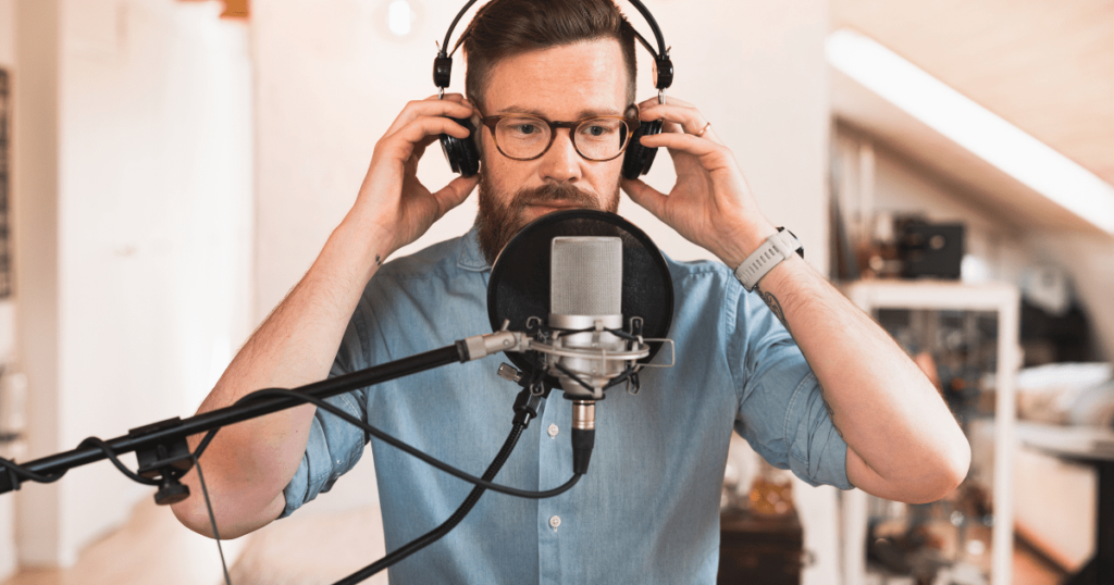 How to Promote a Podcast - Man with Microphone